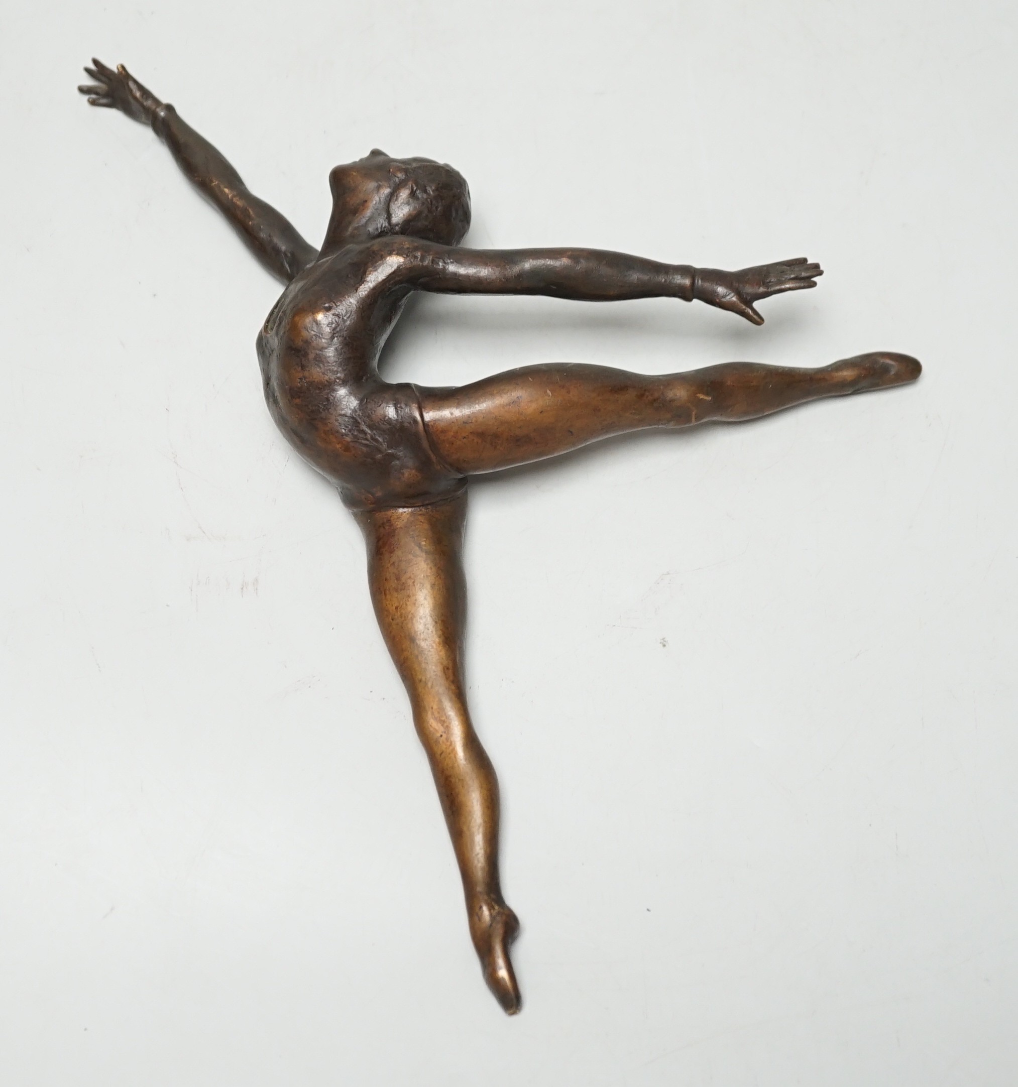 A bronze sculpture of a ballerina. 26cm wide